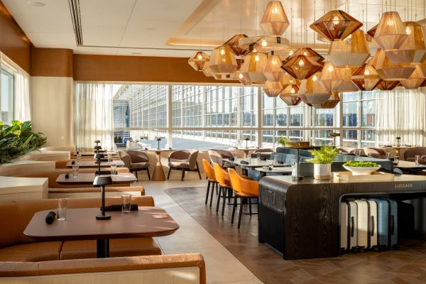 Inside of Capital One Landing restaurant with tables and chairs.